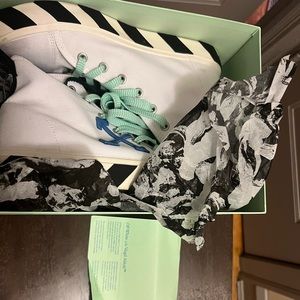 Authentic off white canvas sneakers , slightly worn size 11